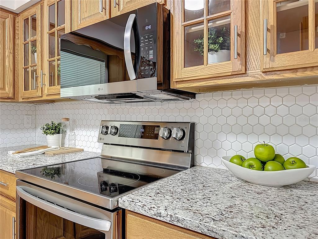 116 Exeter Avenue Longwood, FL 32750 - Photo 8 of 21 a kitchen with a stove and a sink