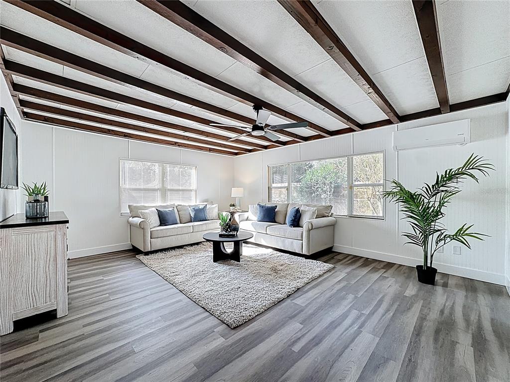 116 Exeter Avenue Longwood, FL 32750 - Photo 9 of 21 a living room with furniture and a large window