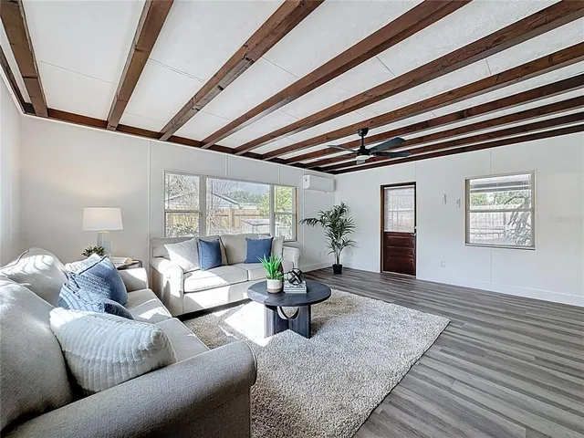 a living room with furniture and a rug