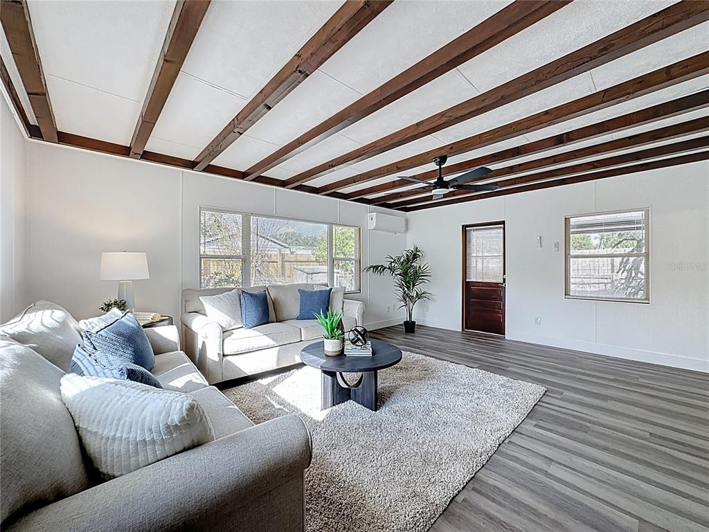 116 Exeter Avenue Longwood, FL 32750 - Photo 10 of 21 a living room with furniture and a rug