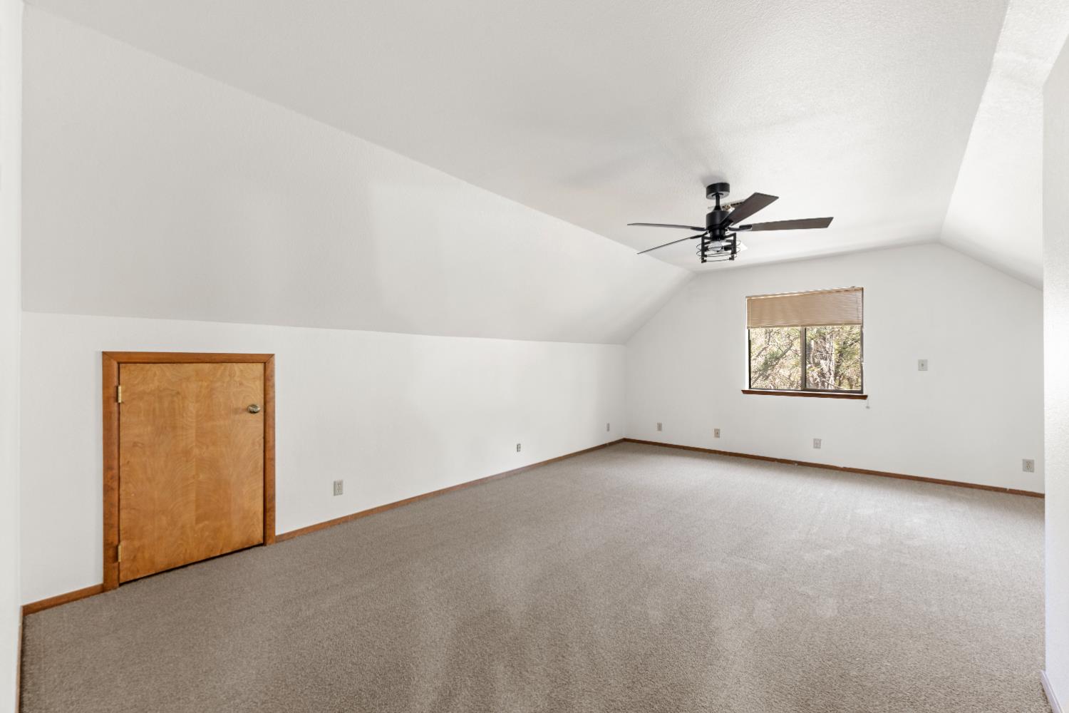 14800 McElroy Road Auburn, CA 95602 - Photo 20 of 39 an empty room with a ceiling fan and windows