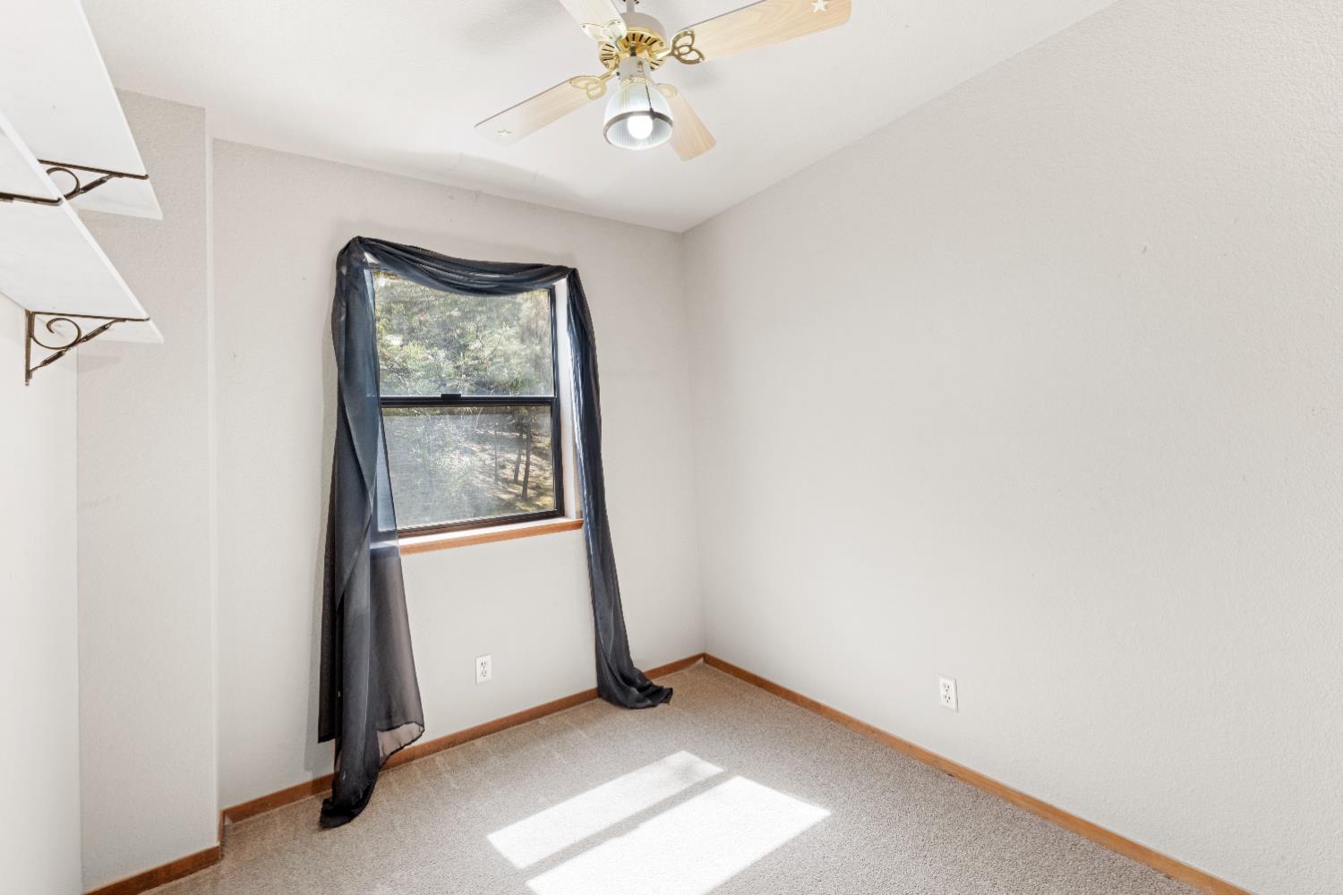 14800 McElroy Road Auburn, CA 95602 - Photo 24 of 39 a view of an empty room with a window