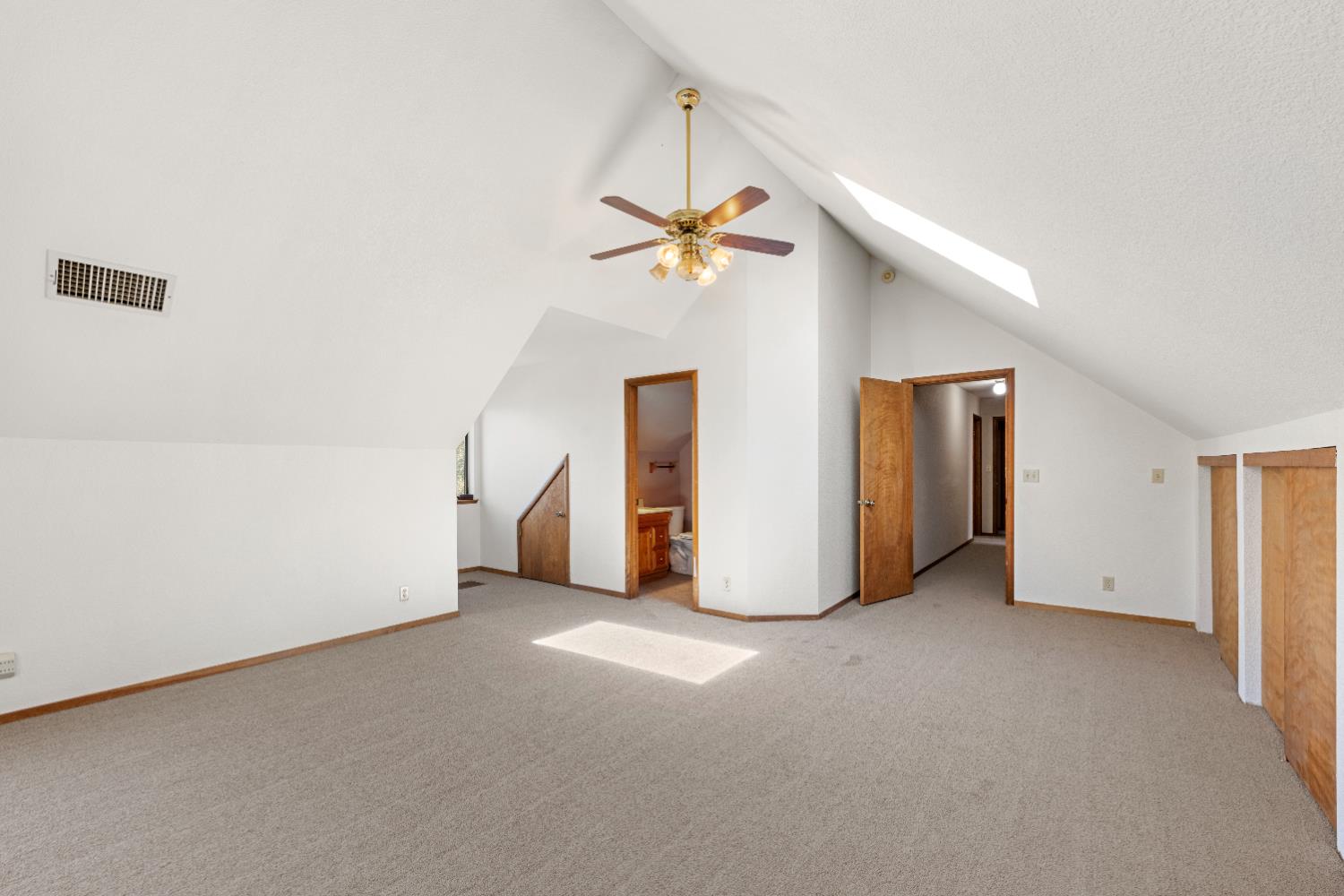 14800 McElroy Road Auburn, CA 95602 - Photo 26 of 39 a view of a livingroom with a ceiling fan and window
