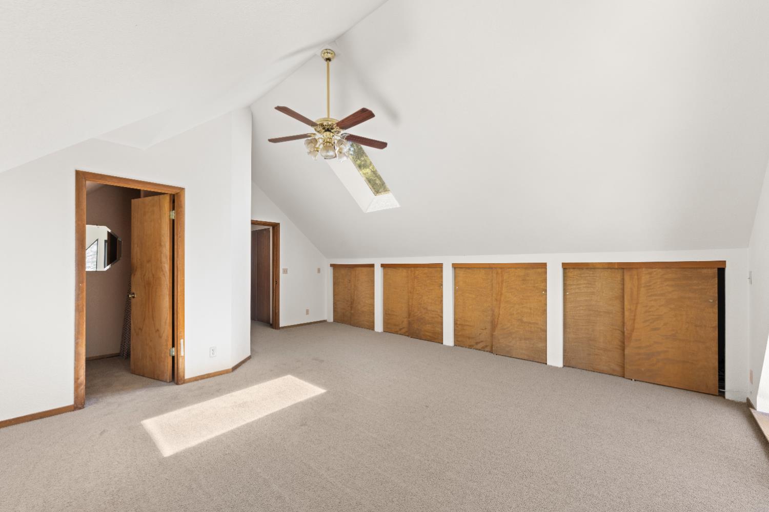 14800 McElroy Road Auburn, CA 95602 - Photo 29 of 39 an empty room with closet and a chandelier fan