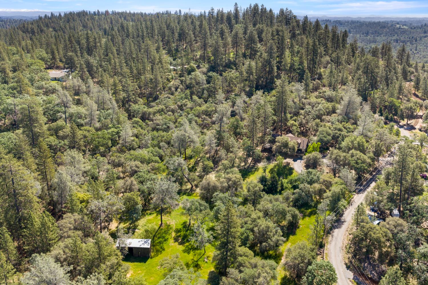 14800 McElroy Road Auburn, CA 95602 - Photo 9 of 39 a view of a city with lush green forest