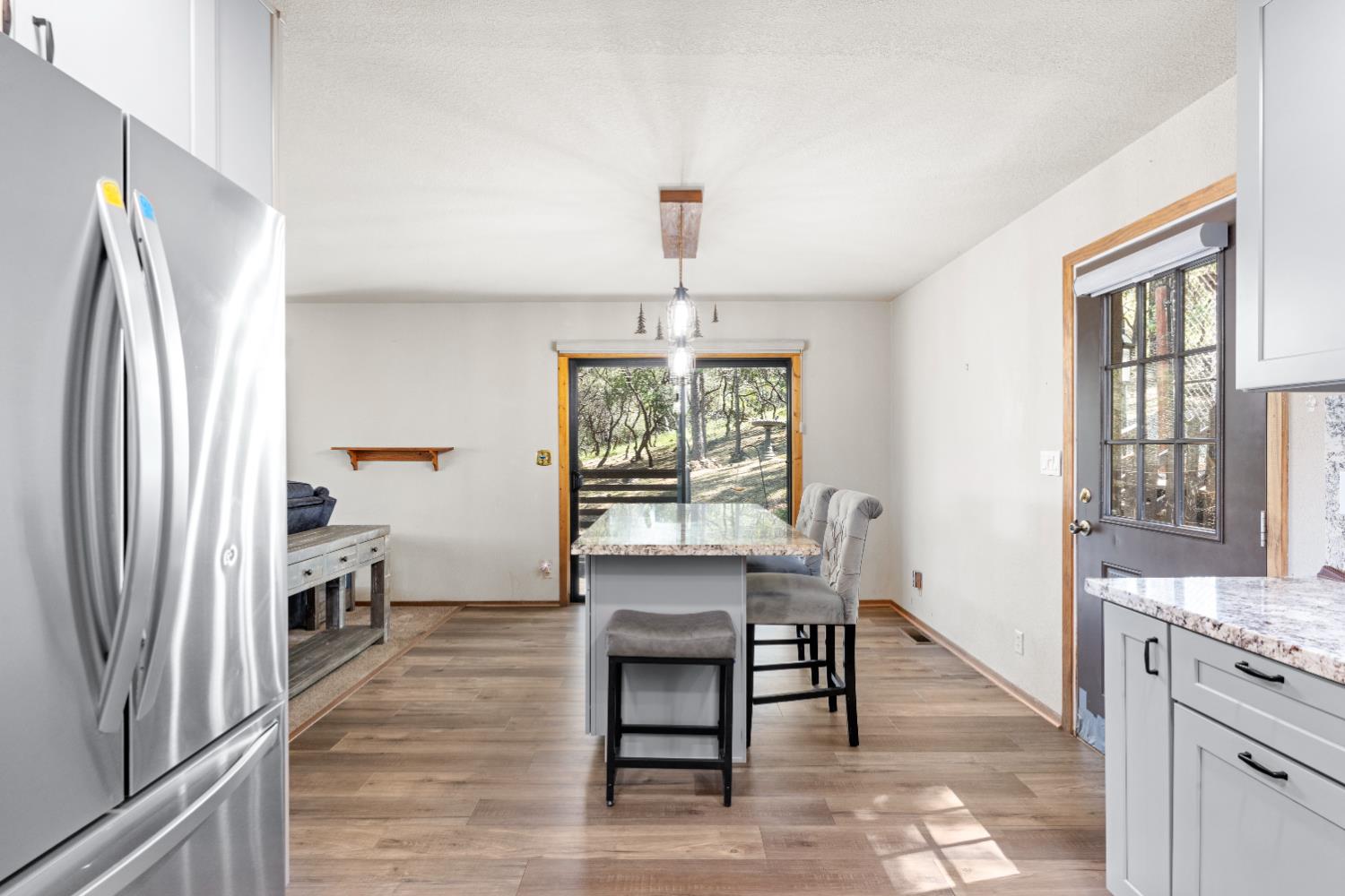 14800 McElroy Road Auburn, CA 95602 - Photo 10 of 39 a view of a dining room with furniture window and wooden floor