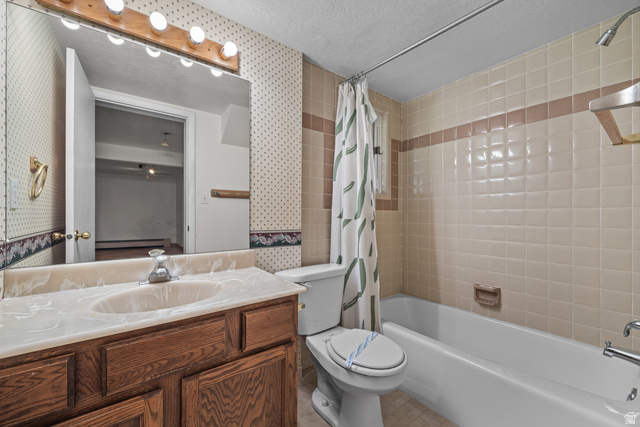 328 Heather Ridge Circle Sandy, UT 84070 - Photo 20 of 28 Bathroom featuring a wood-finish vanity with a built-in sink, a large wall-mounted mirror, and a multi-bulb light fixture