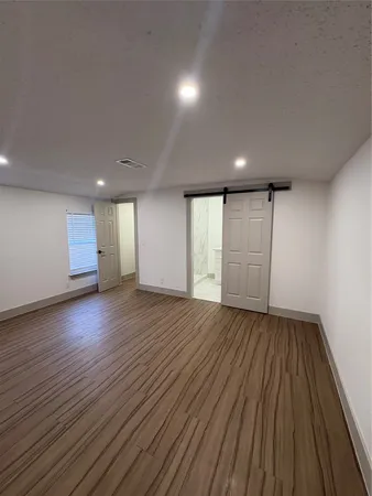 a storage room with wooden floor