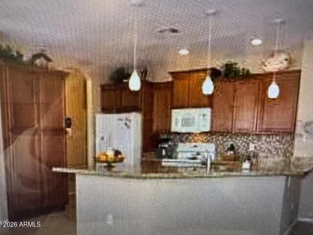 a bathroom with mirror sink and window