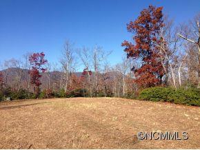 0 Scrivens Road, Unit LOT A Tryon, NC 28782 - Photo 1 of 6 a view of white house with a snow in yard