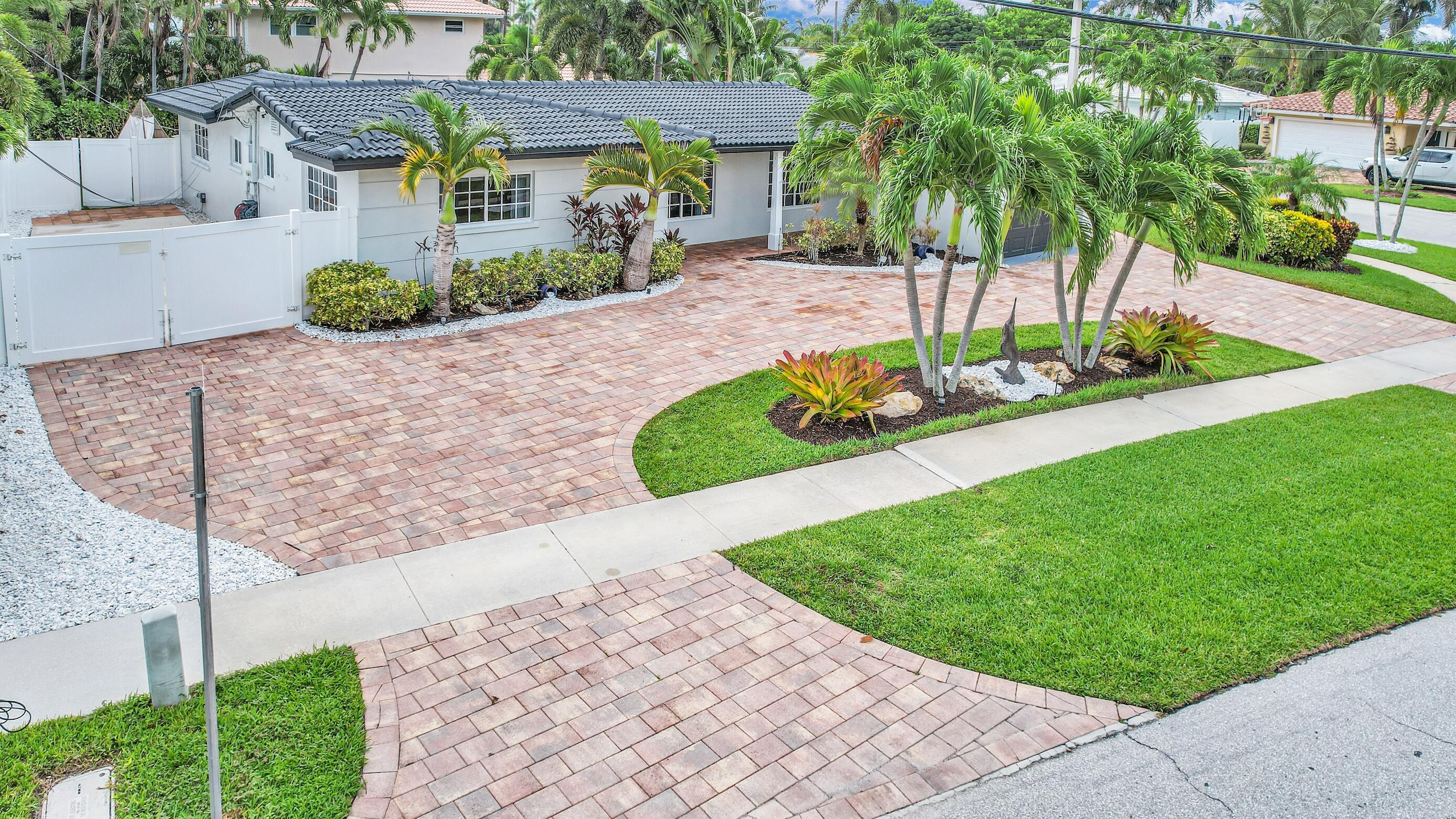 701 Appleby Street Boca Raton, FL 33487 - Photo 2 of 47 a view of a garden with a house