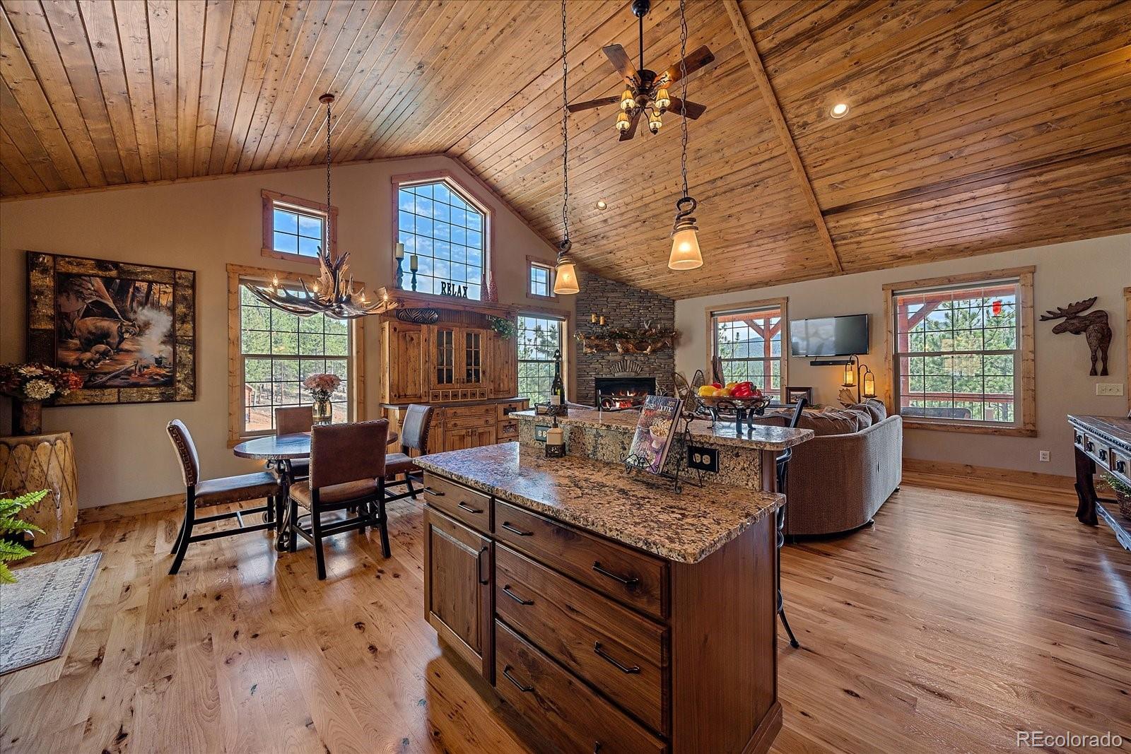 2894 County Road 43 Bailey, CO 80421 - Photo 15 of 48 a view of a dining room with furniture window and wooden floor