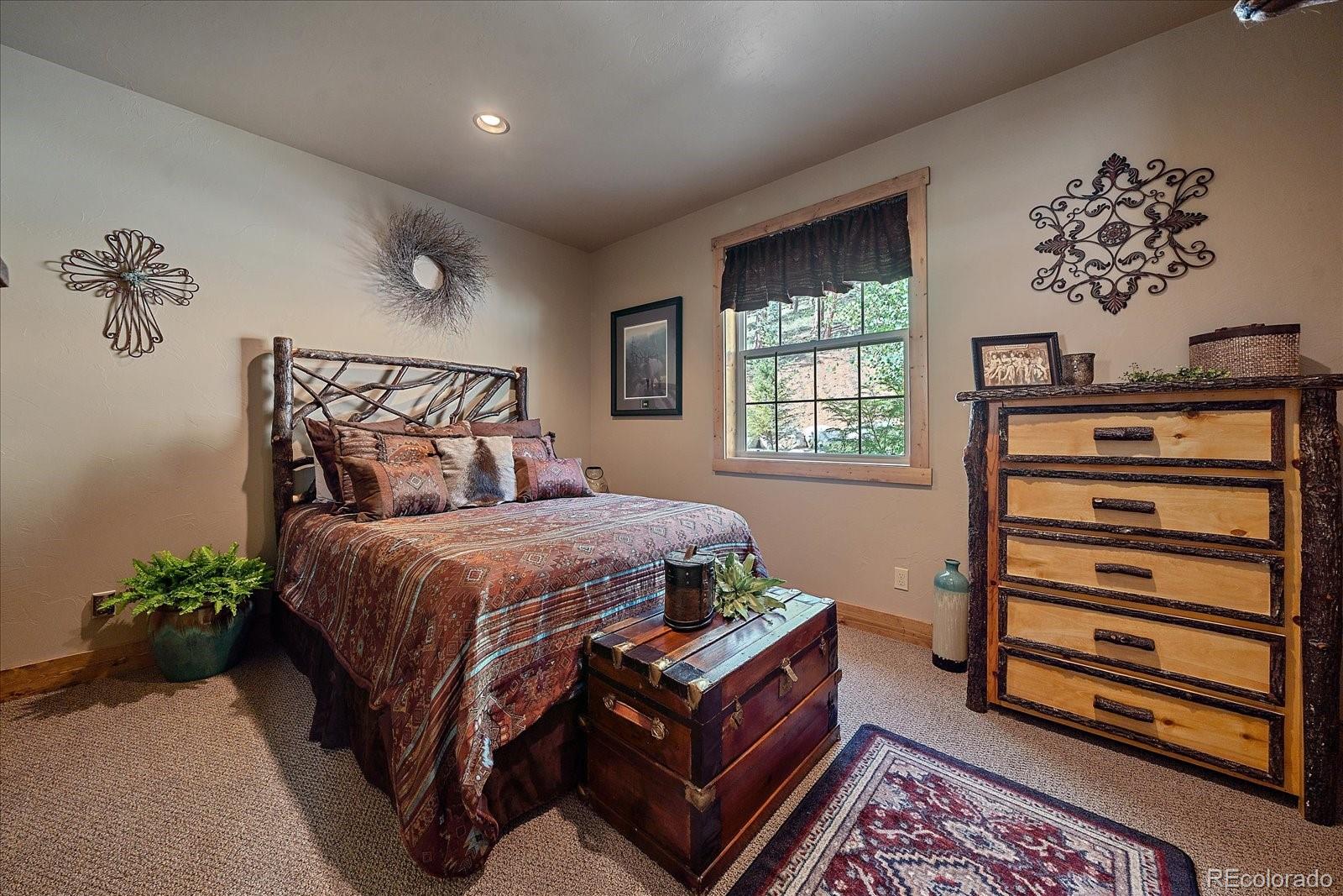 2894 County Road 43 Bailey, CO 80421 - Photo 21 of 48 a bedroom with a bed and a window