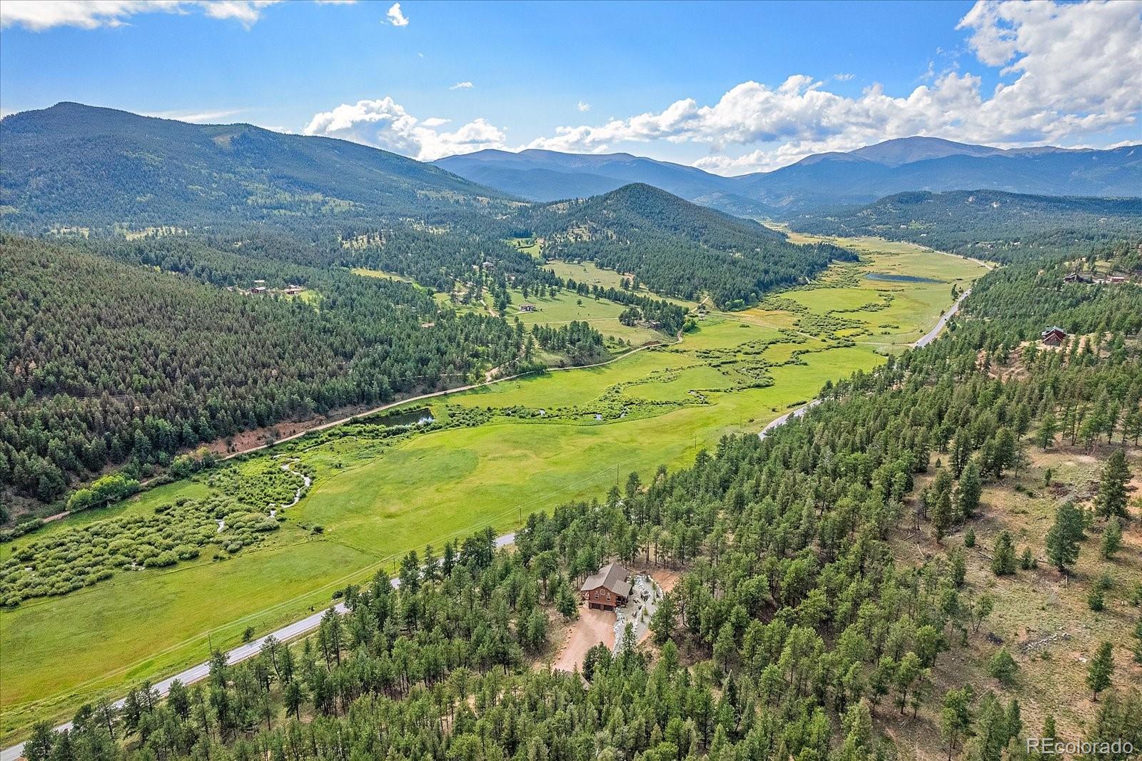 2894 County Road 43 Bailey, CO 80421 - Photo 40 of 48 a view of a lush green hillside and mountains