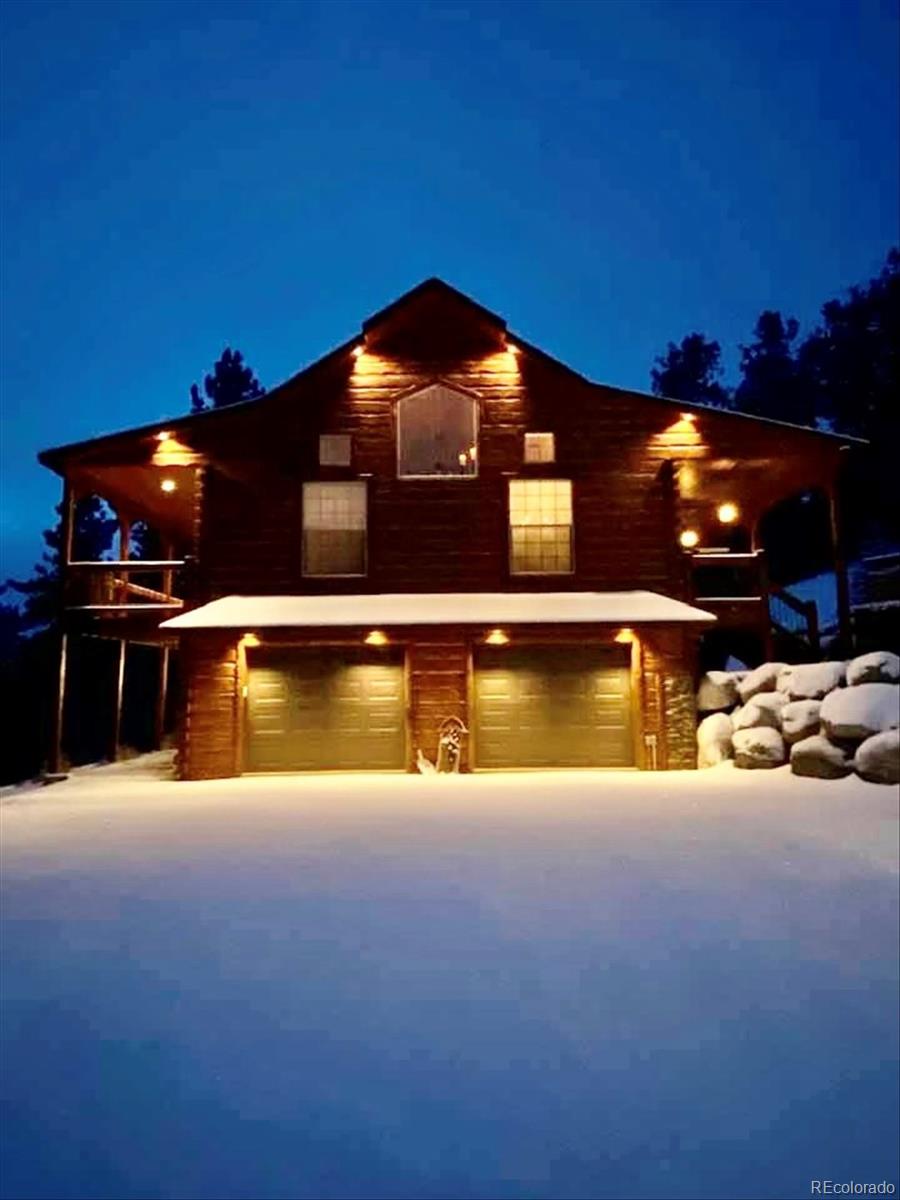 2894 County Road 43 Bailey, CO 80421 - Photo 47 of 48 a view of a swimming pool with an outdoor space and seating area