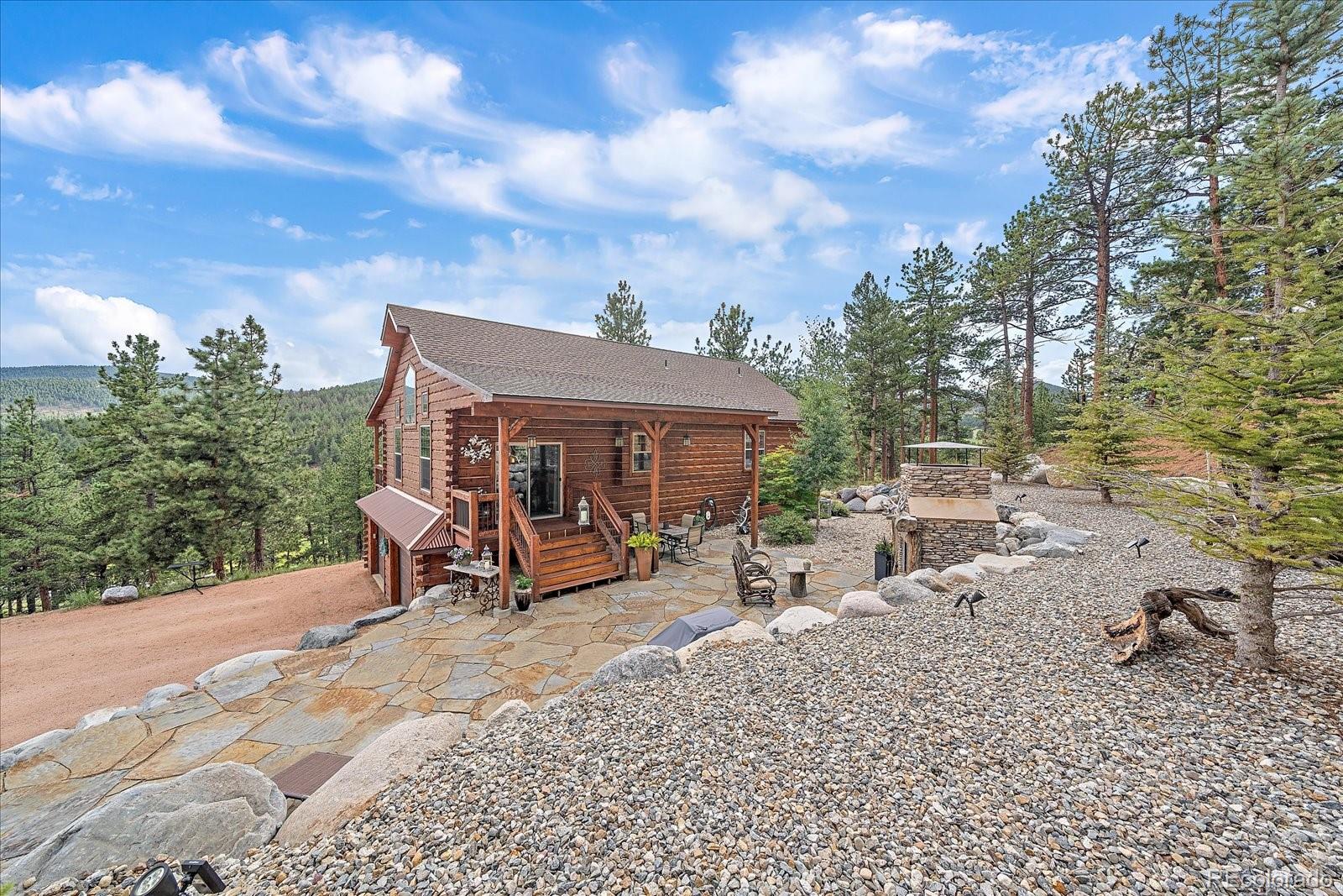 2894 County Road 43 Bailey, CO 80421 - Photo 5 of 48 a view of a backyard with sitting area