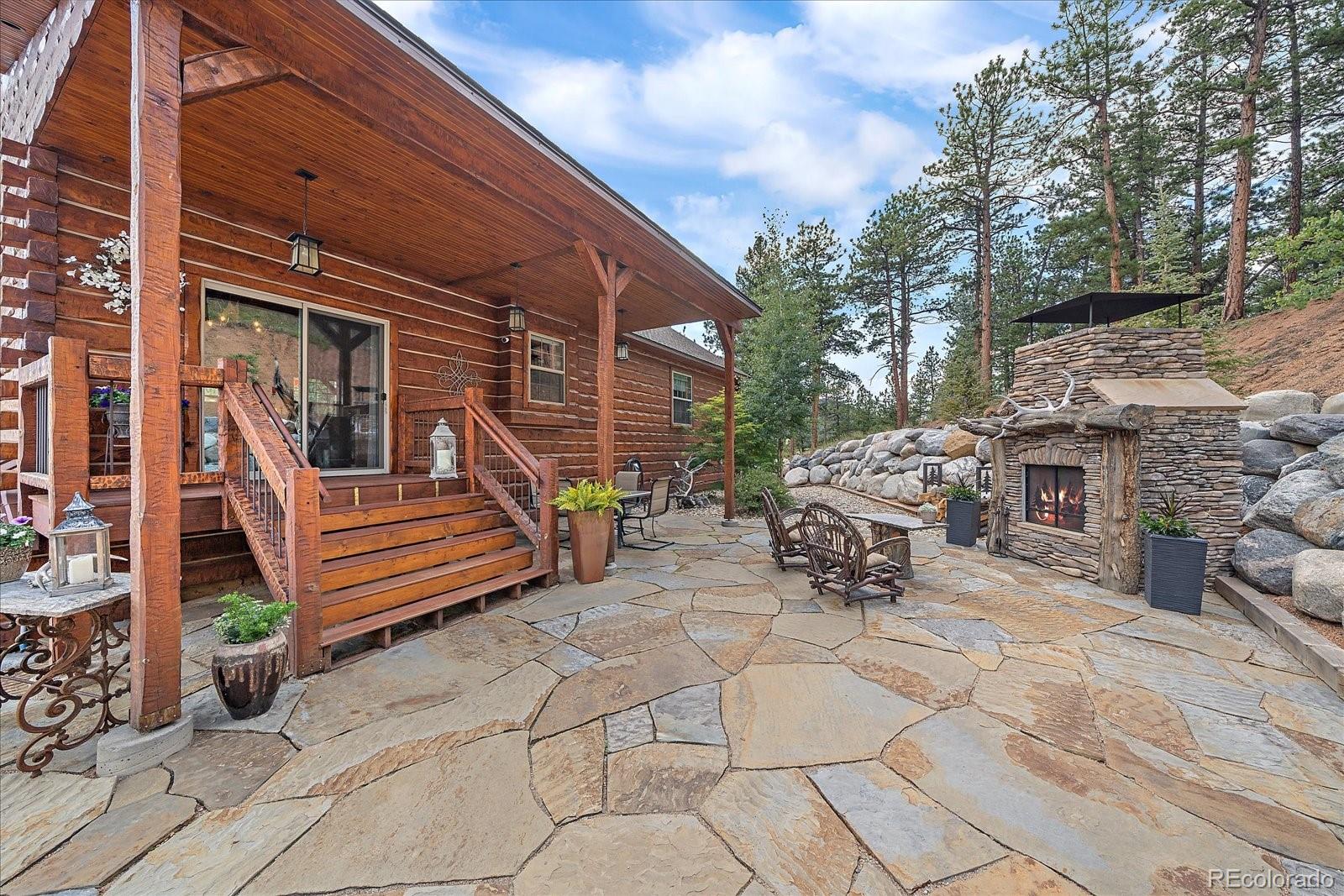 2894 County Road 43 Bailey, CO 80421 - Photo 6 of 48 a view of a patio with two chairs and a table