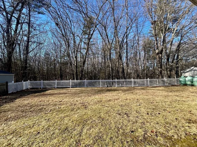 a swimming pool with wooden fence