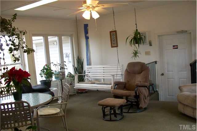 760 Webb Road Dunn, NC 28334 - Photo 11 of 12 Spacious sunroom-door to d/garage,Storage,Shelter