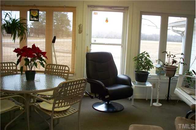 760 Webb Road Dunn, NC 28334 - Photo 12 of 12 Sunroom with view to highway & land