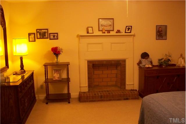 Main bedroom to left of foyer has hookup for gas logs
