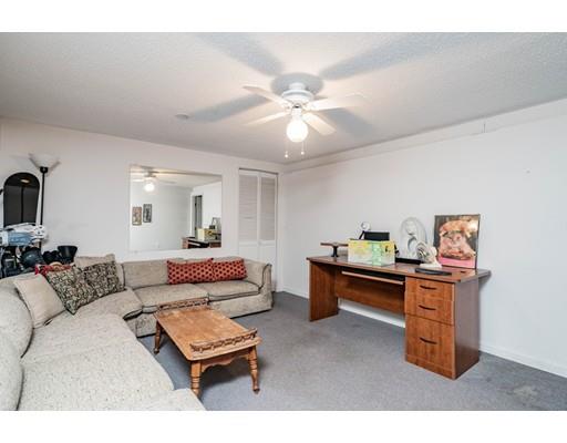 309 Frank Smith Road Longmeadow, MA 01106 - Photo 25 of 41 a living room with furniture and a dining table with projector