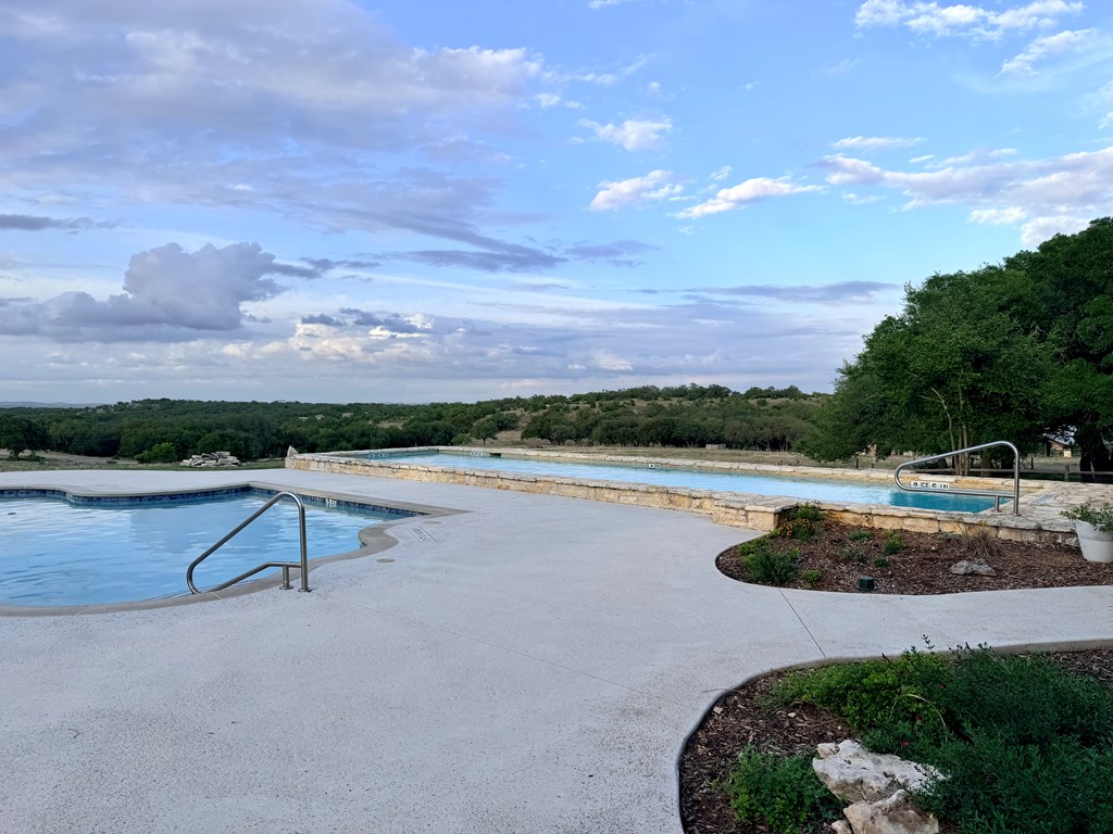 768 North Walnut Springs Road, Unit 26 Johnson City, TX 78636 - Photo 17 of 23 a view of a lake with outdoor space