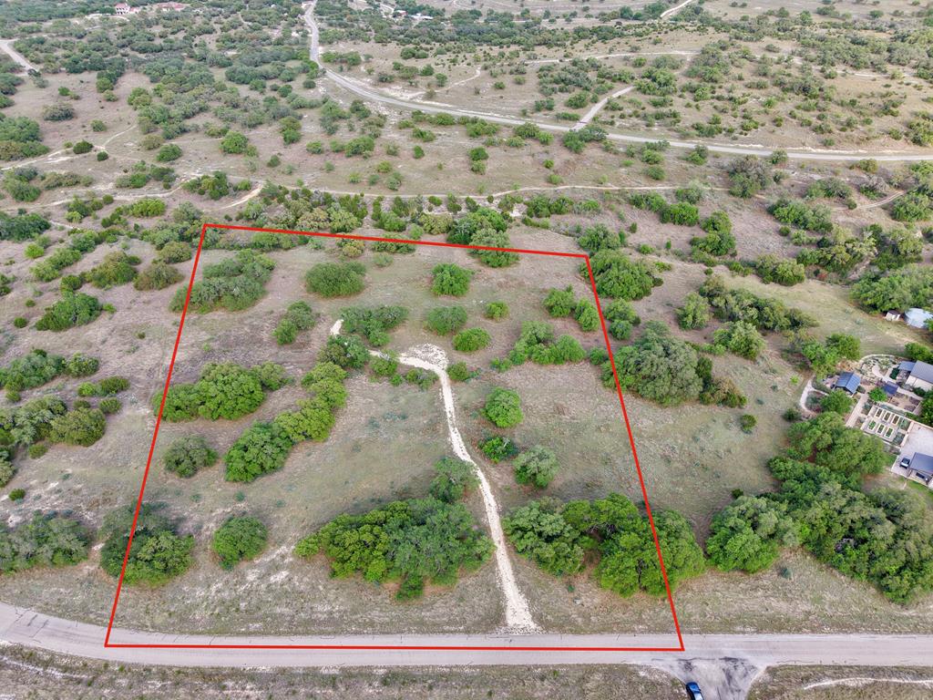 768 North Walnut Springs Road, Unit 26 Johnson City, TX 78636 - Photo 23 of 23 an aerial view of residential houses with outdoor space