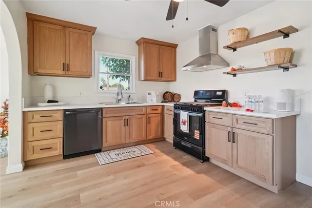 a kitchen with a stove oven and sink