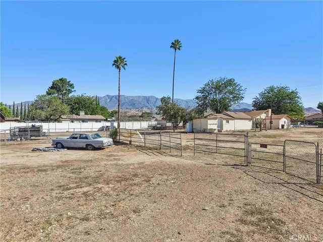 a house view with a sitting space and garden