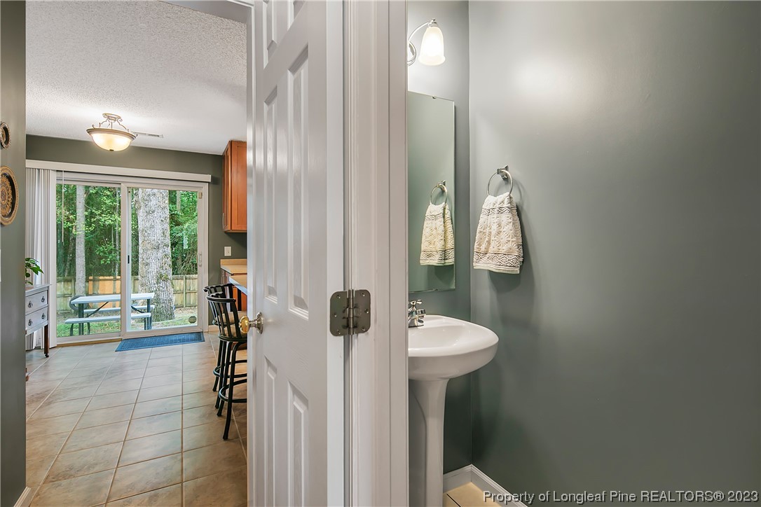 82 Hillandale Road Spring Lake, NC 28390 - Photo 11 of 50 a bathroom with a sink toilet and tub