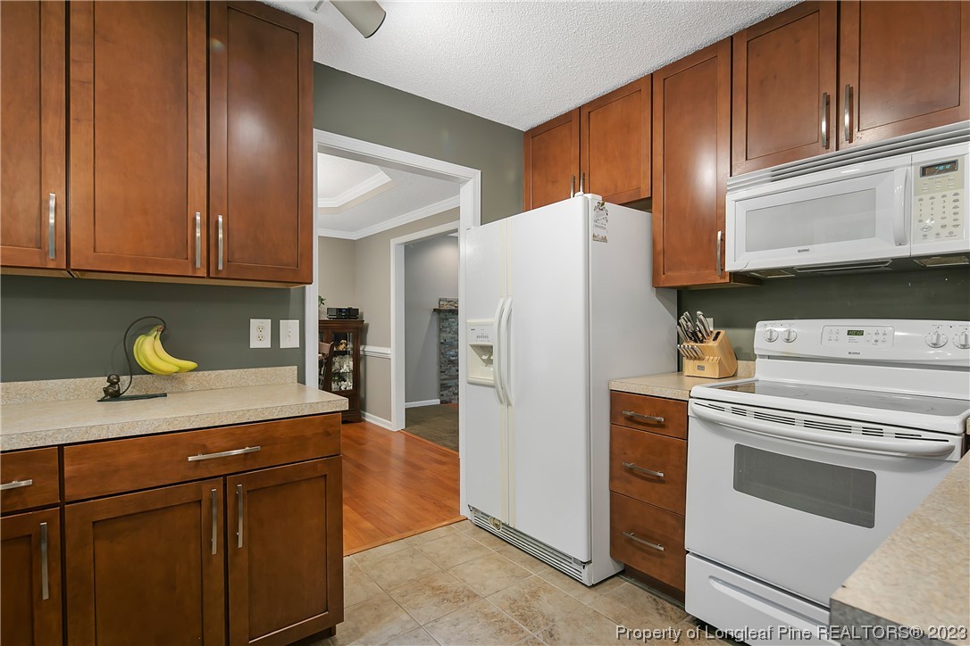 82 Hillandale Road Spring Lake, NC 28390 - Photo 20 of 50 a kitchen with a white cabinets and refrigerator