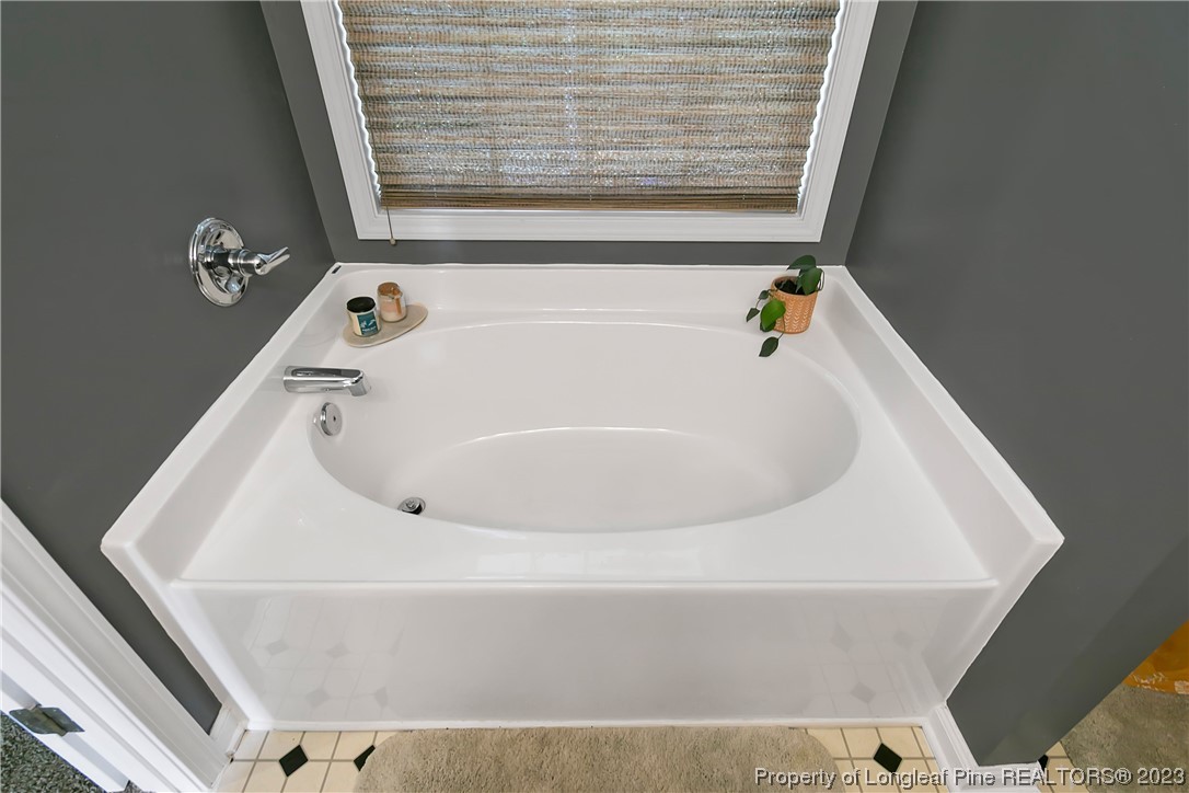 82 Hillandale Road Spring Lake, NC 28390 - Photo 33 of 50 a bathroom with a white bath tub