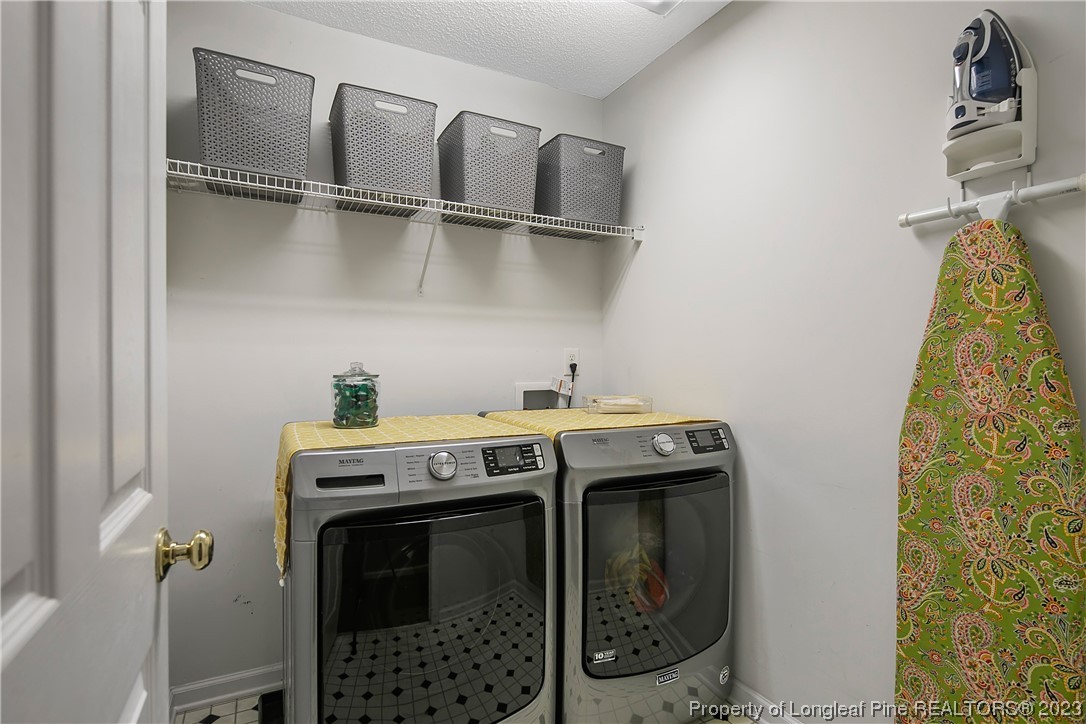 82 Hillandale Road Spring Lake, NC 28390 - Photo 34 of 50 a utility room with dryer and washer