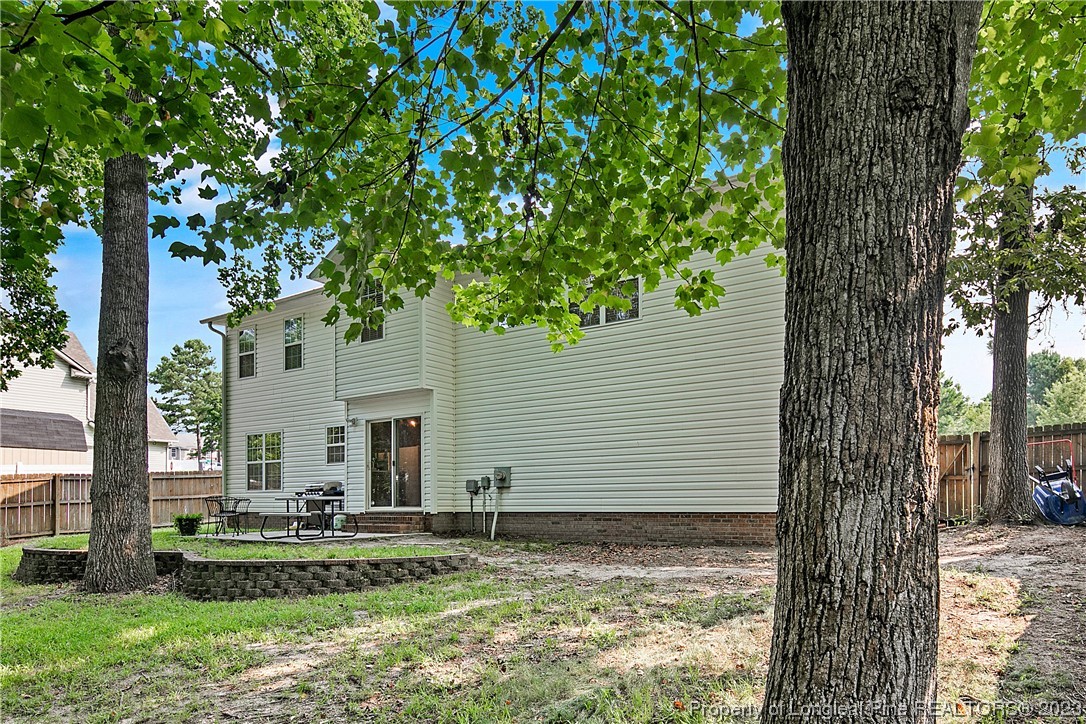 82 Hillandale Road Spring Lake, NC 28390 - Photo 48 of 50 a view of a house with a tree in front of it