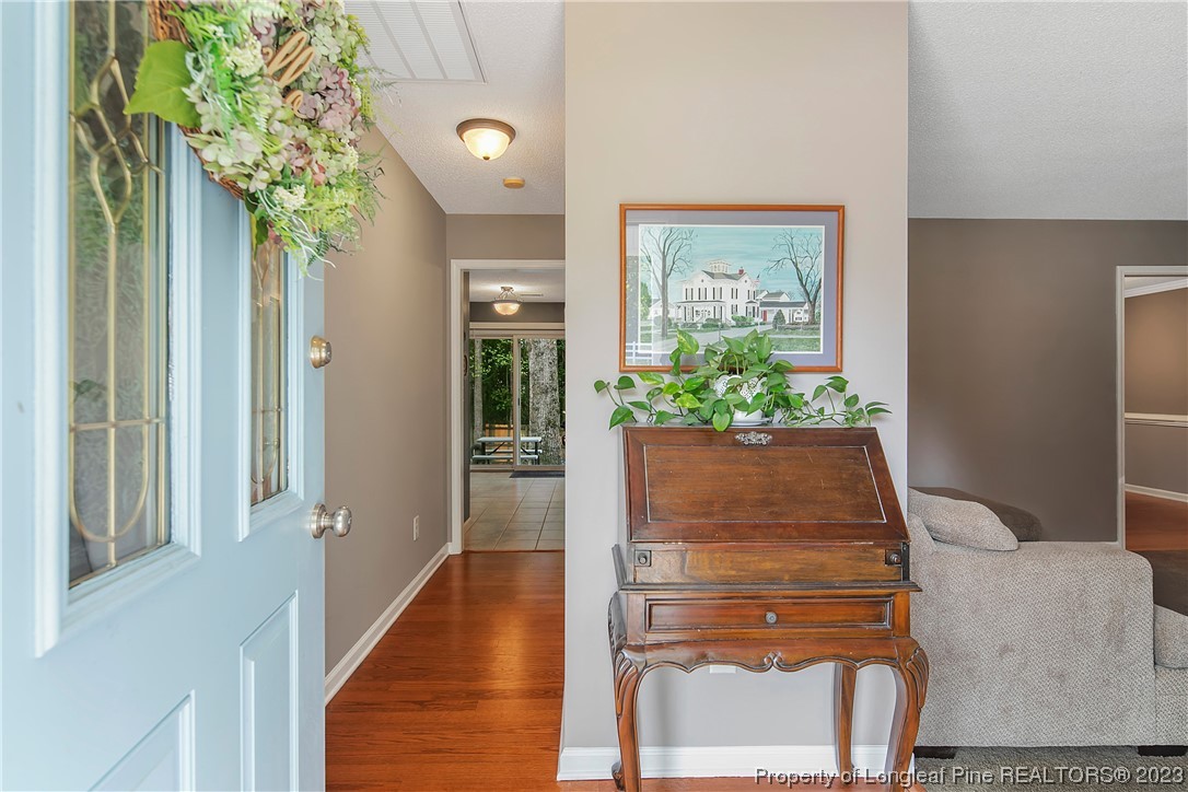 82 Hillandale Road Spring Lake, NC 28390 - Photo 5 of 50 a potted plant sitting on a wooden floor