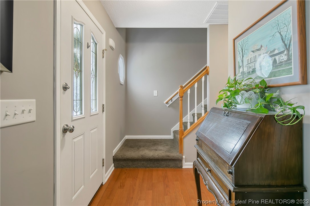 82 Hillandale Road Spring Lake, NC 28390 - Photo 6 of 50 a view of front door with wooden floor and stairs