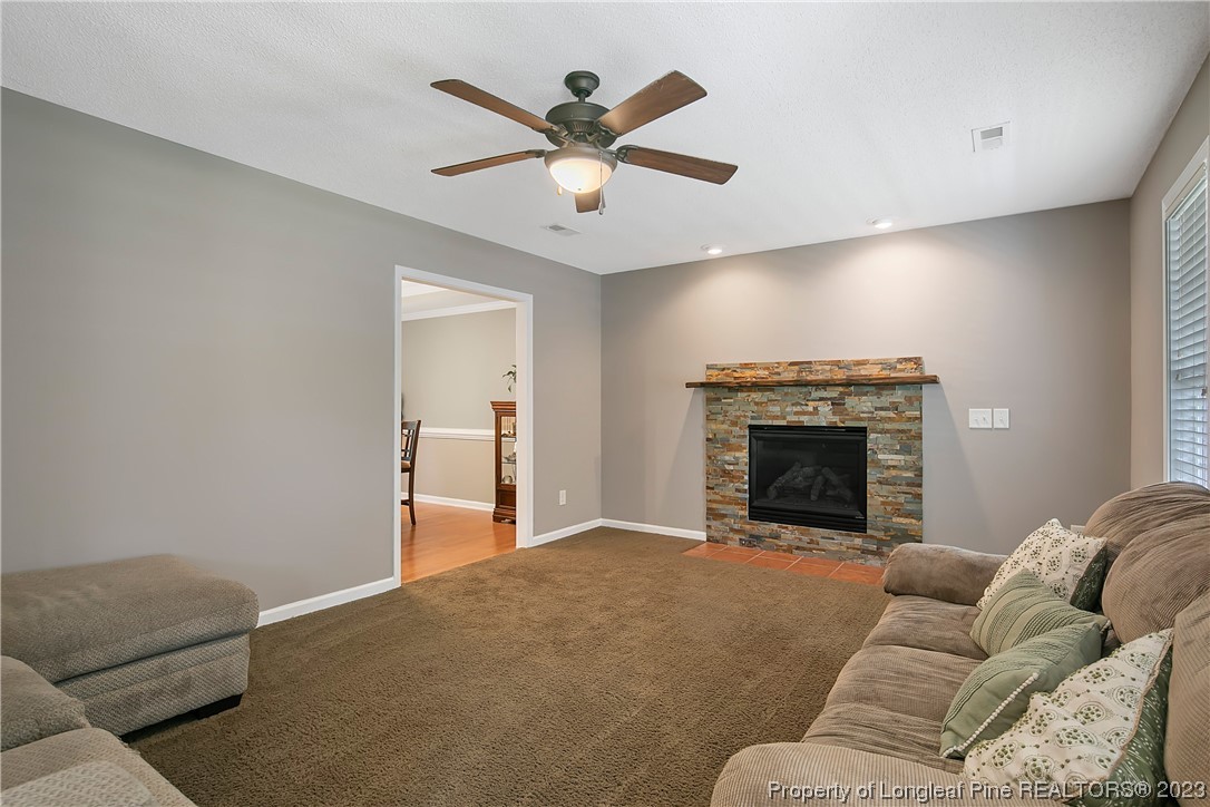 82 Hillandale Road Spring Lake, NC 28390 - Photo 7 of 50 a living room with furniture and a fireplace