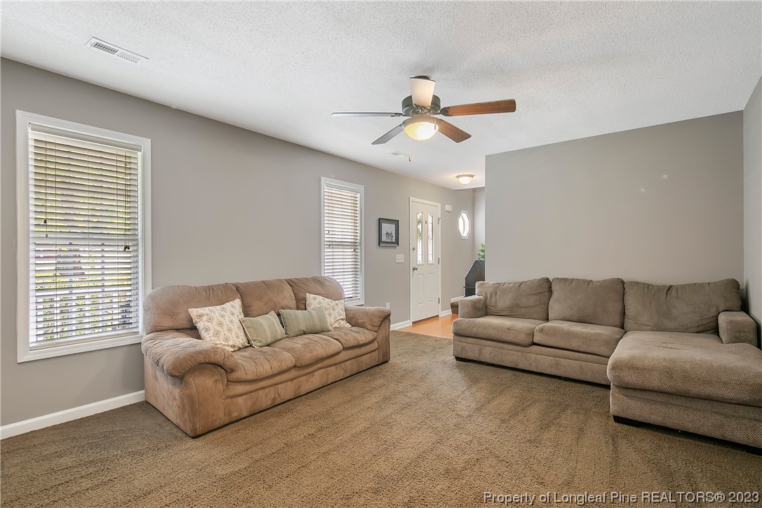 82 Hillandale Road Spring Lake, NC 28390 - Photo 9 of 50 a living room with furniture and a large window