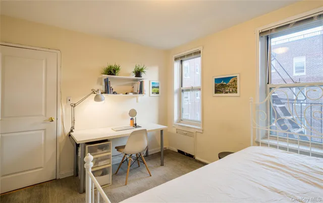 a bedroom with a bed and a table in it