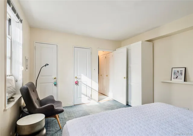 a bedroom with a bed and a couch