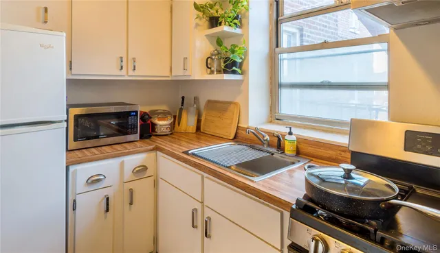 a kitchen with a stove and a sink