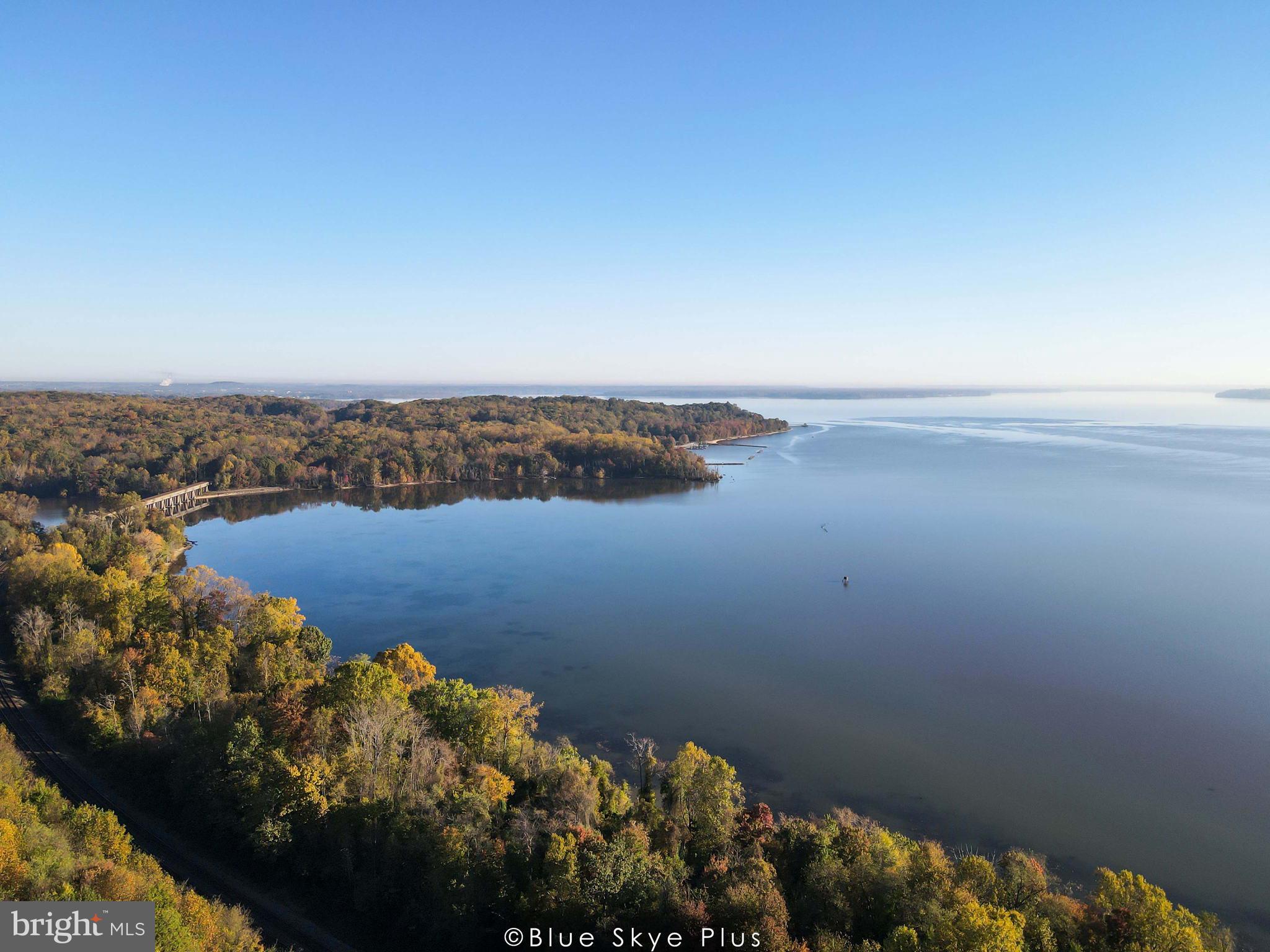 2252 Red Pine Loop Dumfries, VA 22026 - Photo 11 of 117 an aerial view of lake and residential houses with outdoor space