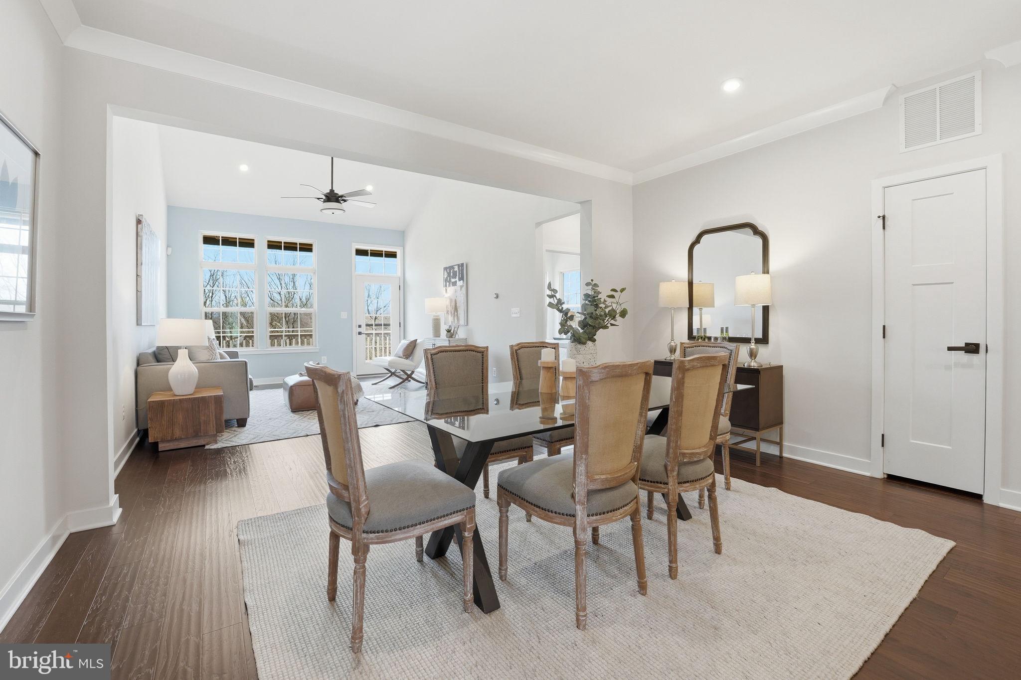 2252 Red Pine Loop Dumfries, VA 22026 - Photo 25 of 117 a view of a dining room with furniture and wooden floor