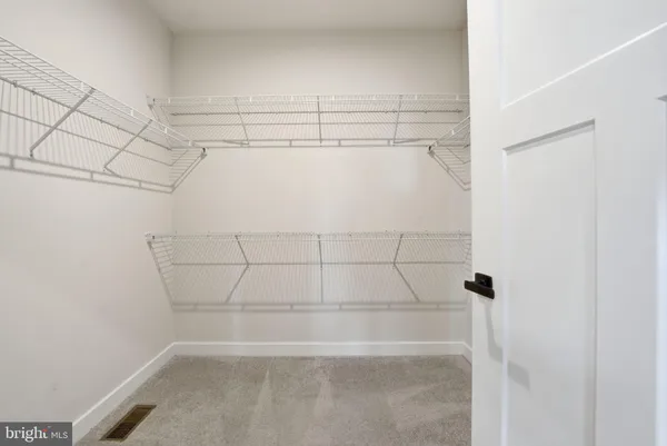 a white bath tub sitting next to a toilet