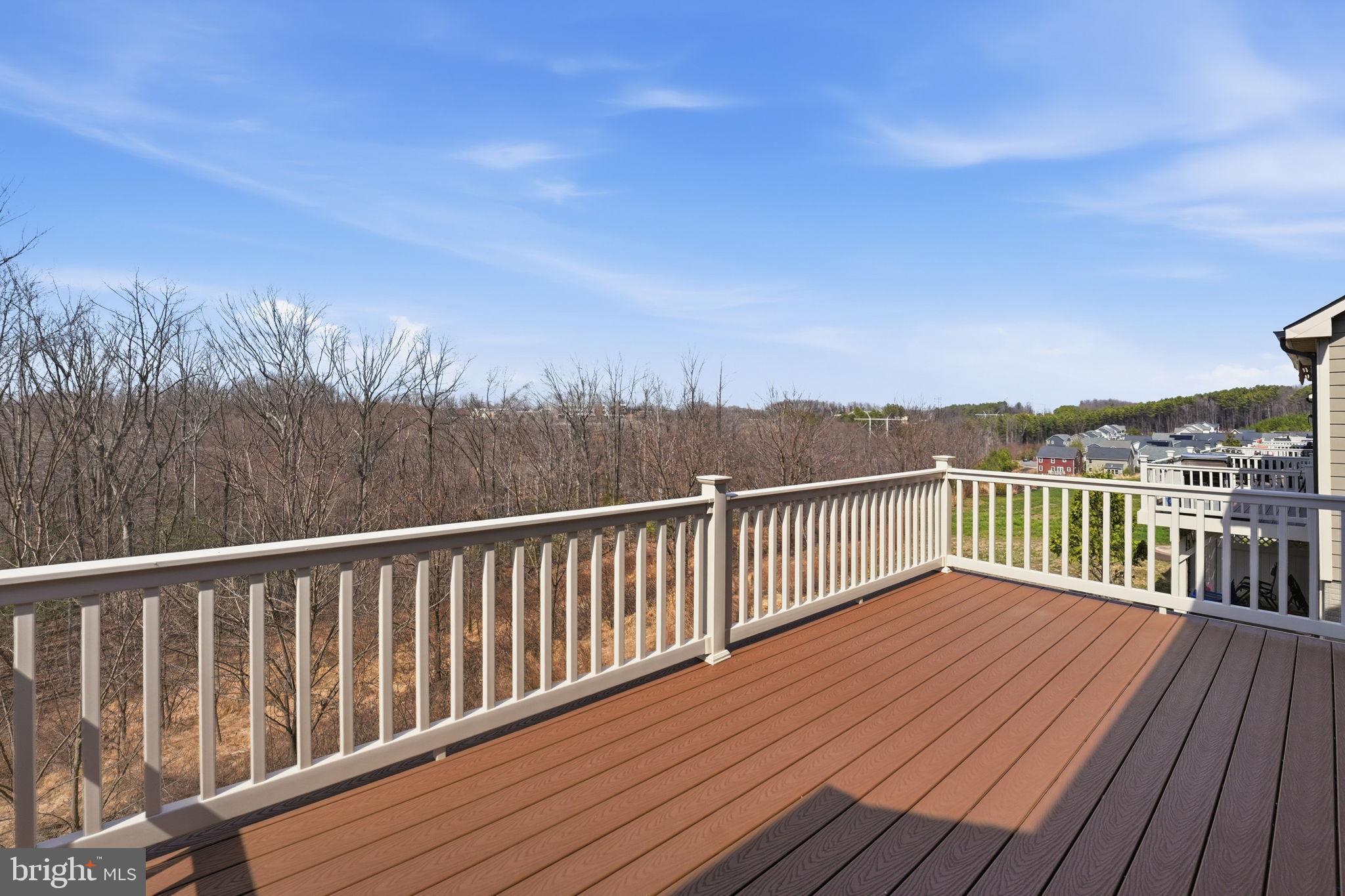 2252 Red Pine Loop Dumfries, VA 22026 - Photo 33 of 117 a view of balcony with wooden floor and fence