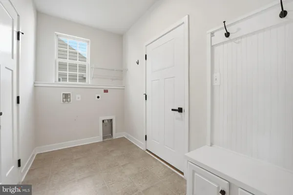 a kitchen with stainless steel appliances granite countertop a refrigerator stove and white cabinets