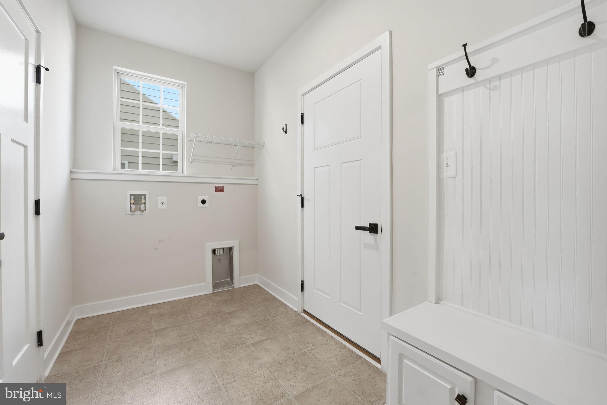 2252 Red Pine Loop Dumfries, VA 22026 - Photo 6 of 87 Laundry/Mud Room w/bench off 2-car garage
