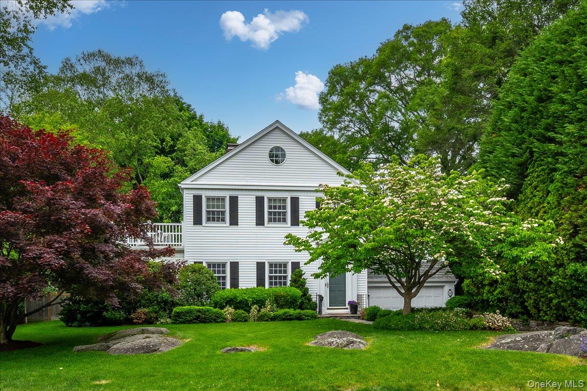 49 Eton Road Larchmont, NY 10538 - Photo 1 of 34 a front view of a house with a garden