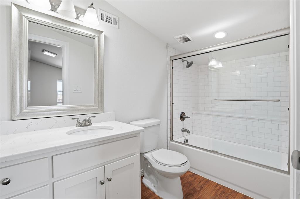 103 West Cleburne Road Crowley, TX 76036 - Photo 17 of 18 a bathroom with a sink a toilet and shower